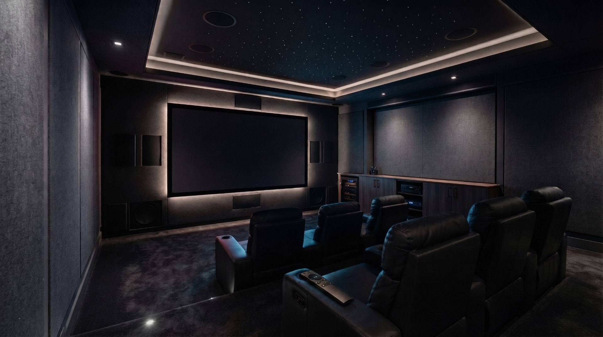 Private home theater with starlit ceiling, custom lighting, and premium seating